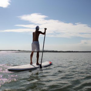 Person paddleboarding on the water